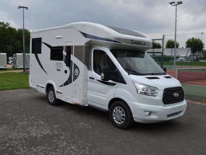 Chausson 634 parked with a tennis court in the background