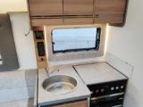 Kitchen area, with four-burner hob and large sink