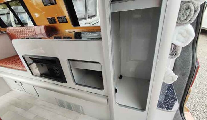 Kitchen with tambour-door cupboard